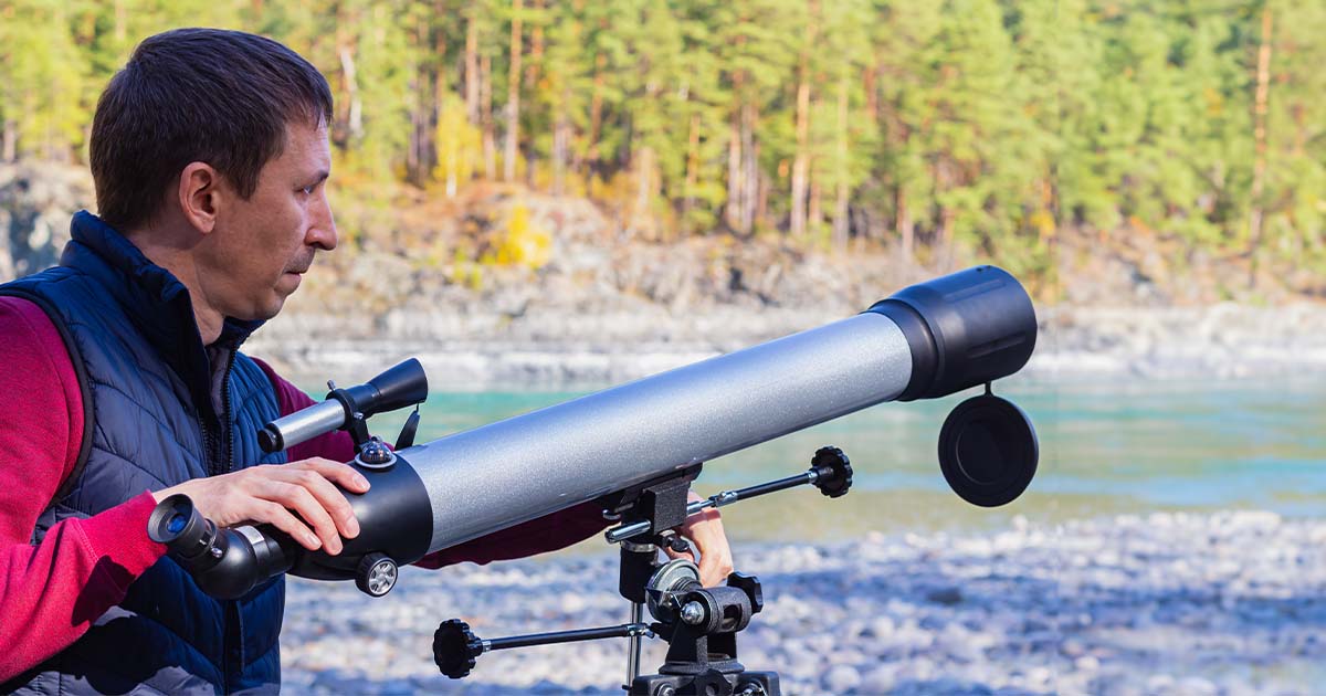 man with telescope