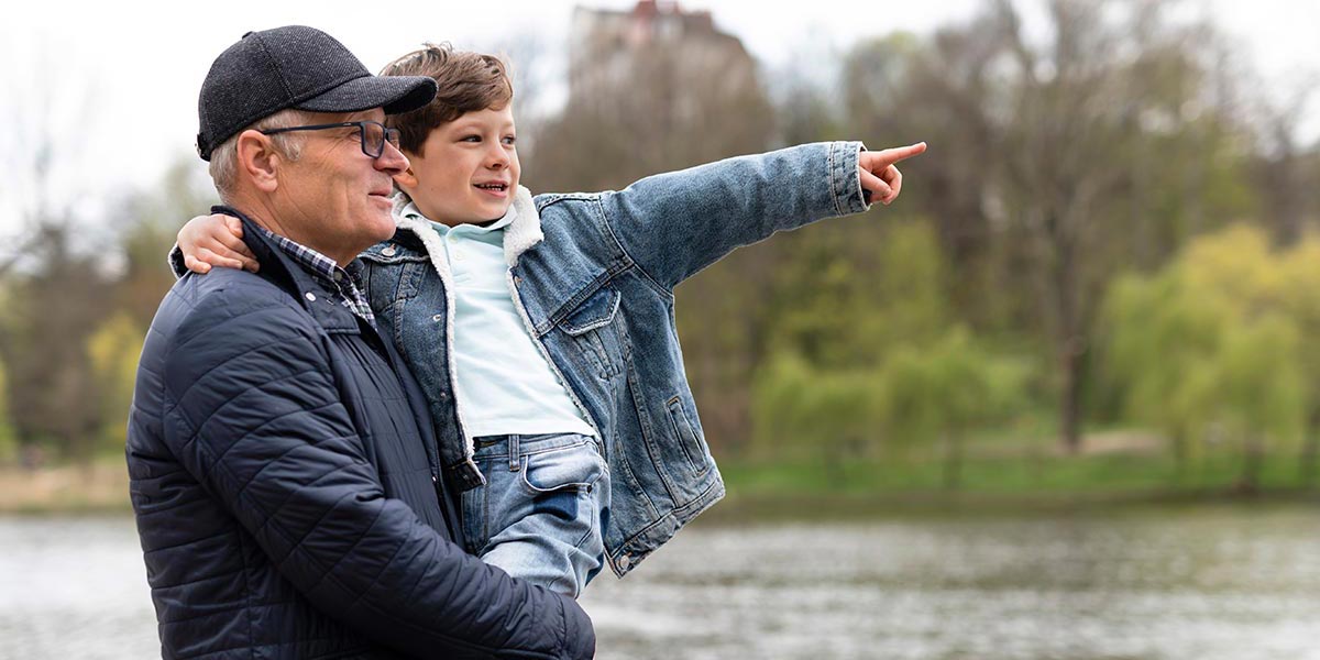 Grandpa and grandson at the lake